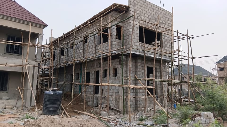 Blockwork structure with bamboo scaffolding on site, 2026