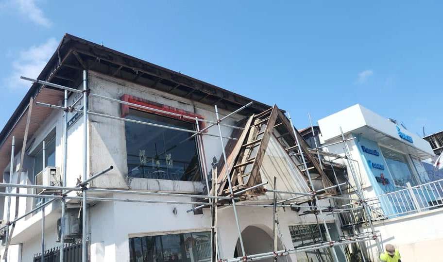 Store facade during redevelopment with scaffolding — Admiralty Road, Lekki, Lagos