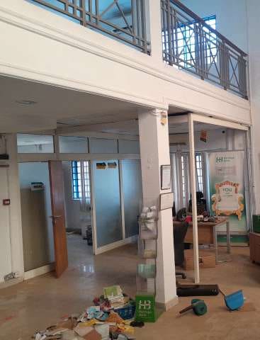 Existing building before works: hall with mezzanine and columns — Sango Otta, Ogun State